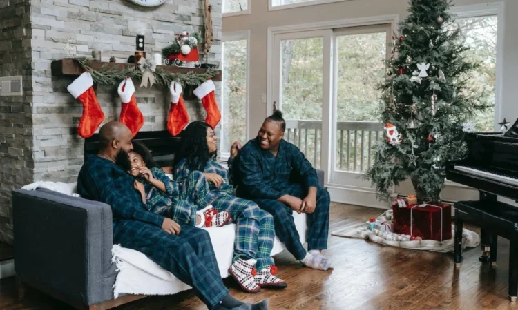 happy black family in Christmas-themed living room - Seasonal Shifts: Easy Ways to Revitalize Your Home Decor