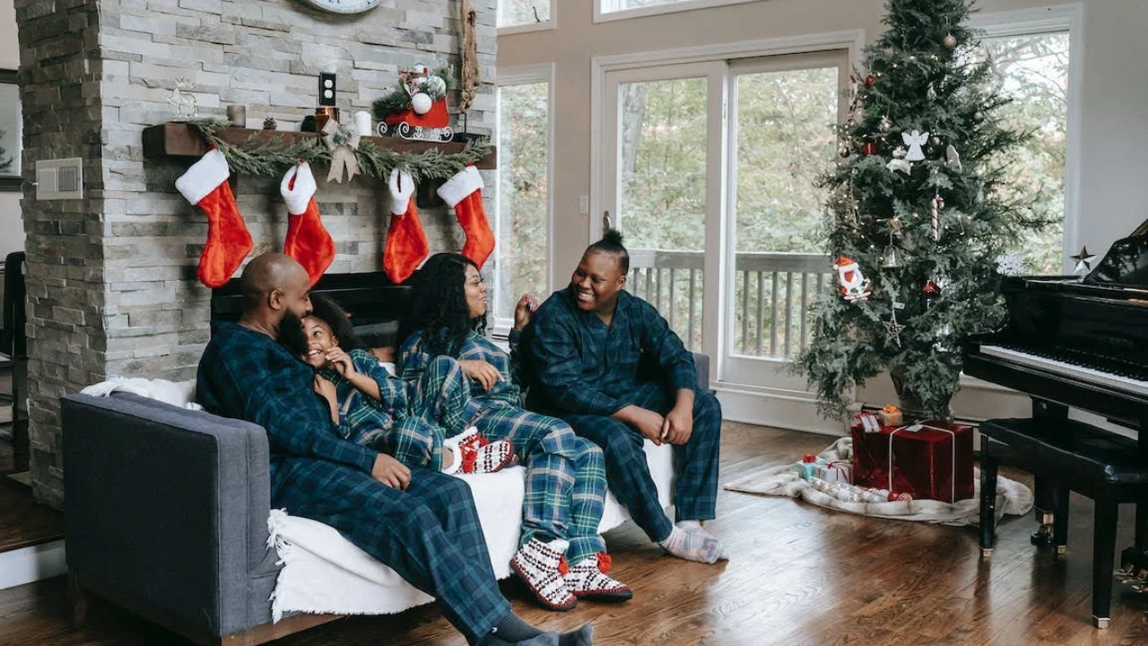 happy black family in Christmas-themed living room - Seasonal Shifts: Easy Ways to Revitalize Your Home Decor